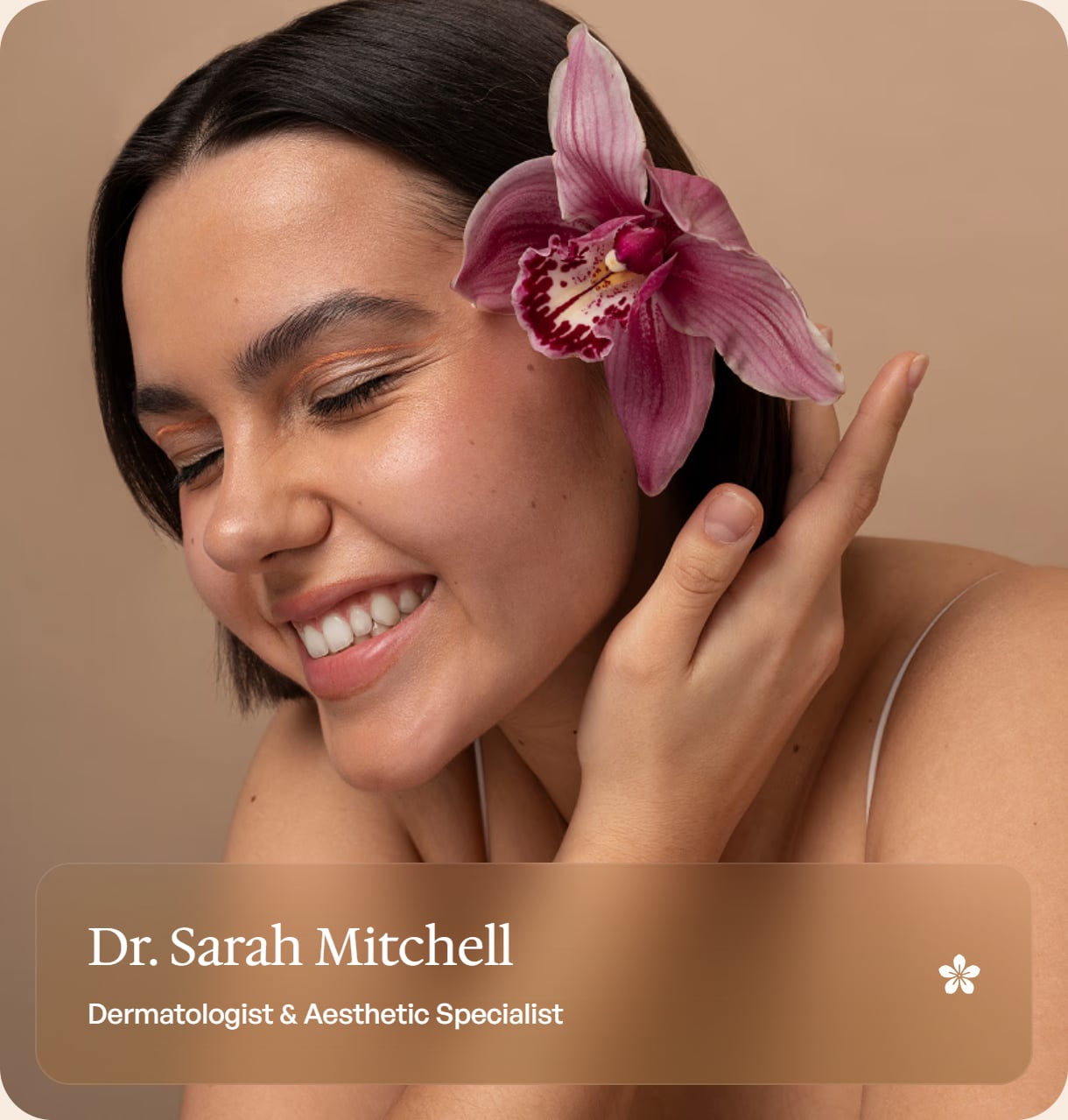 Dr. Sarah Mitchell, Dermatologist & Aesthetic Specialist — smiling woman with a pink orchid in her hair